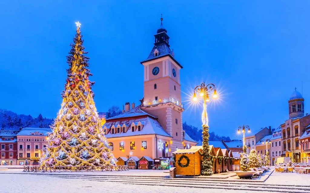 Brasov, Romania. Old Town Christmas Market at twilight.
