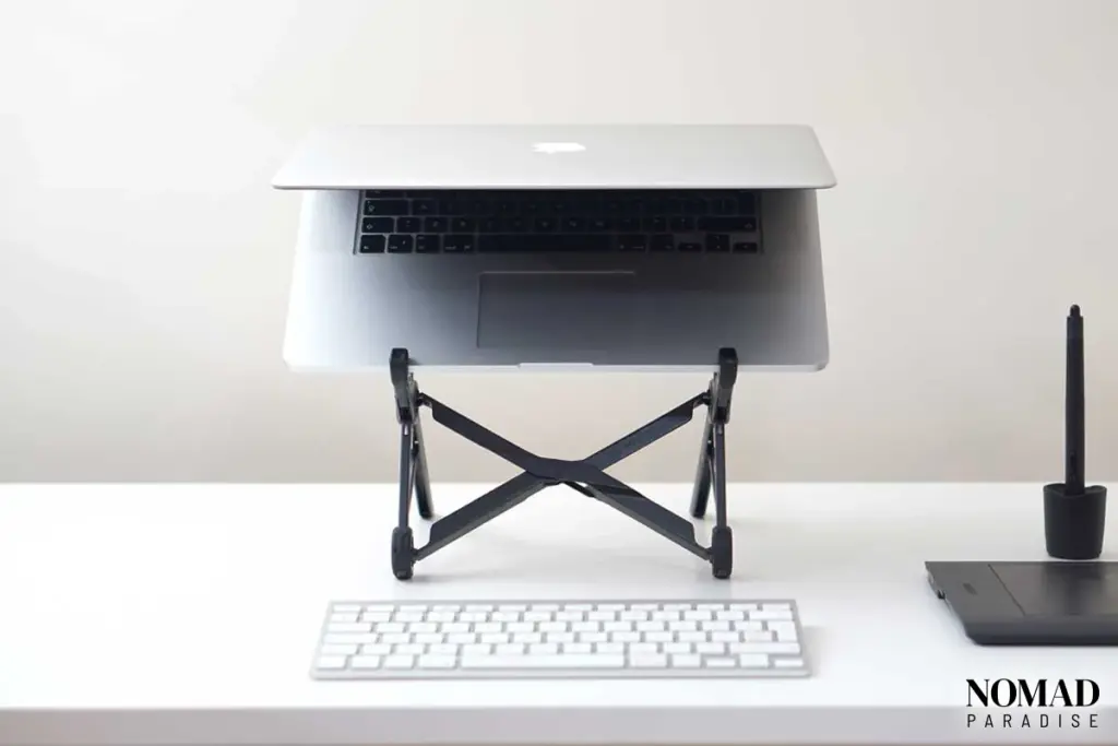 Macbook on roost stand with apple wireless keyboard