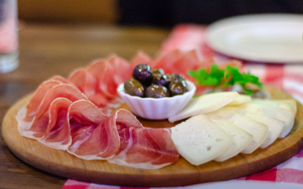 Njegusi prosciutto, cheese, and olives board