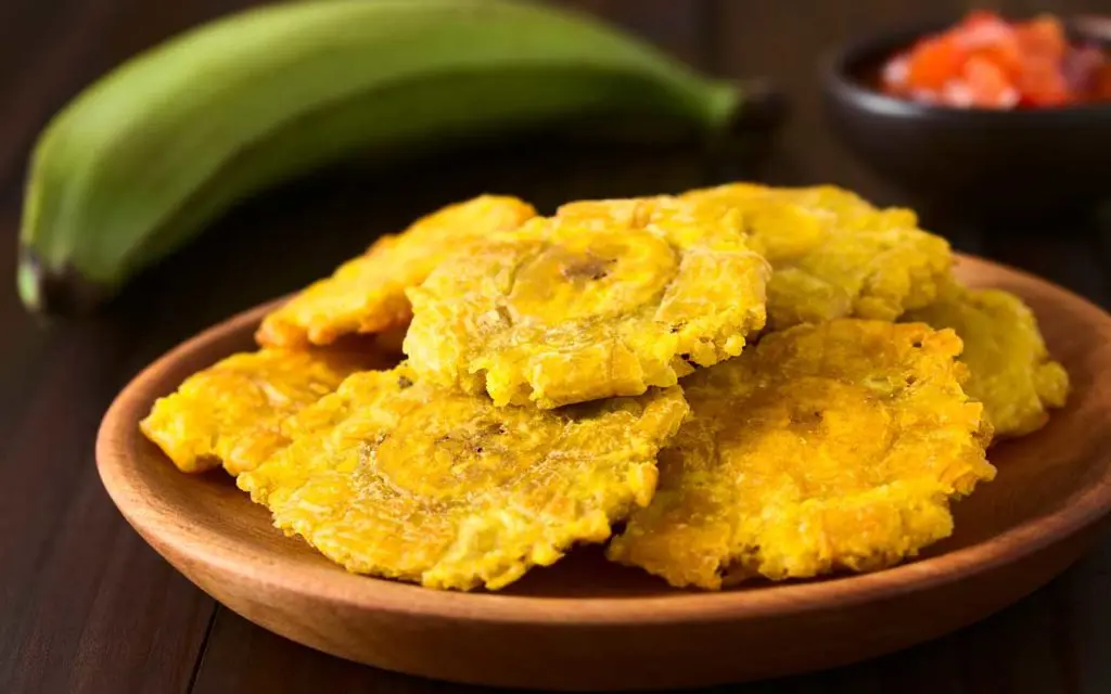 Ecuadorian food: patacones con queso - fried green plantain "crackers" with cheese