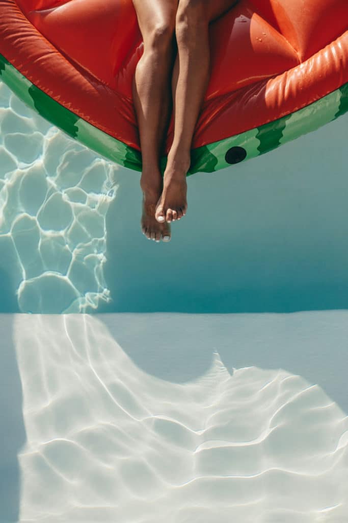 Staycation idea: at the pool on a watermelon pool inflatable.