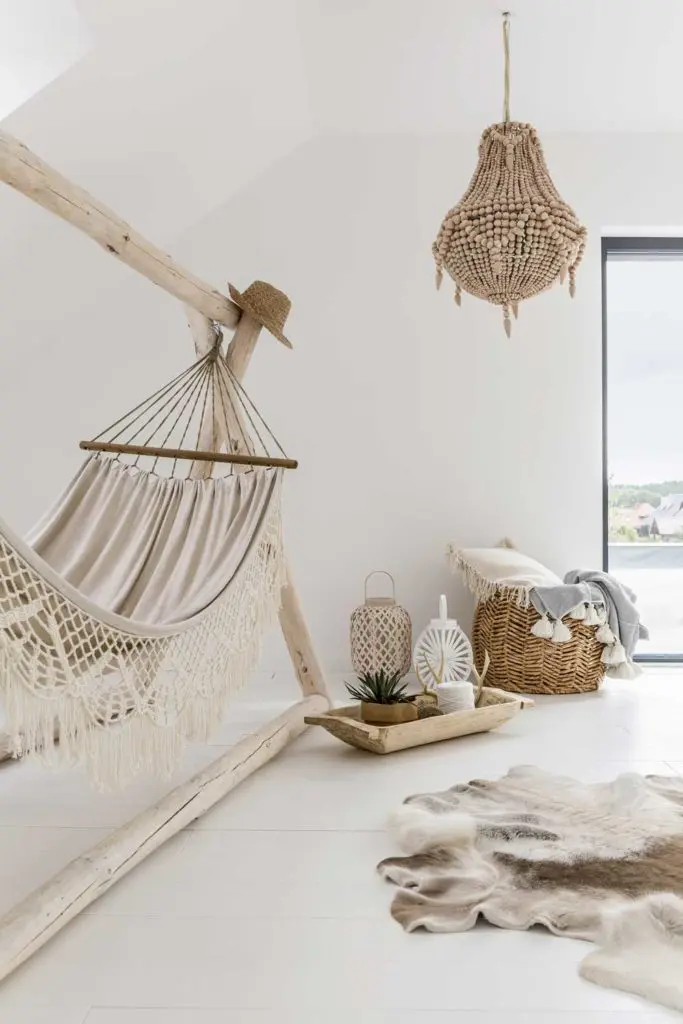 Staycation idea: Beige home oasis with a hammock and other relaxing touches.