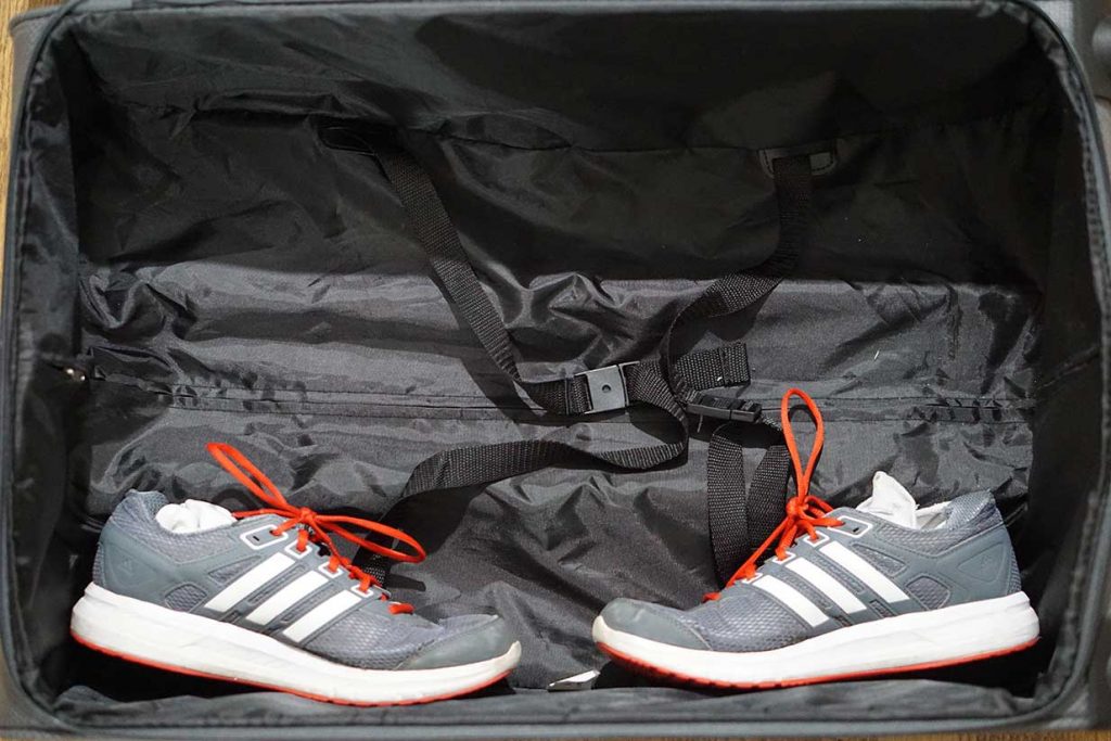 packing sneakers in a suitcase