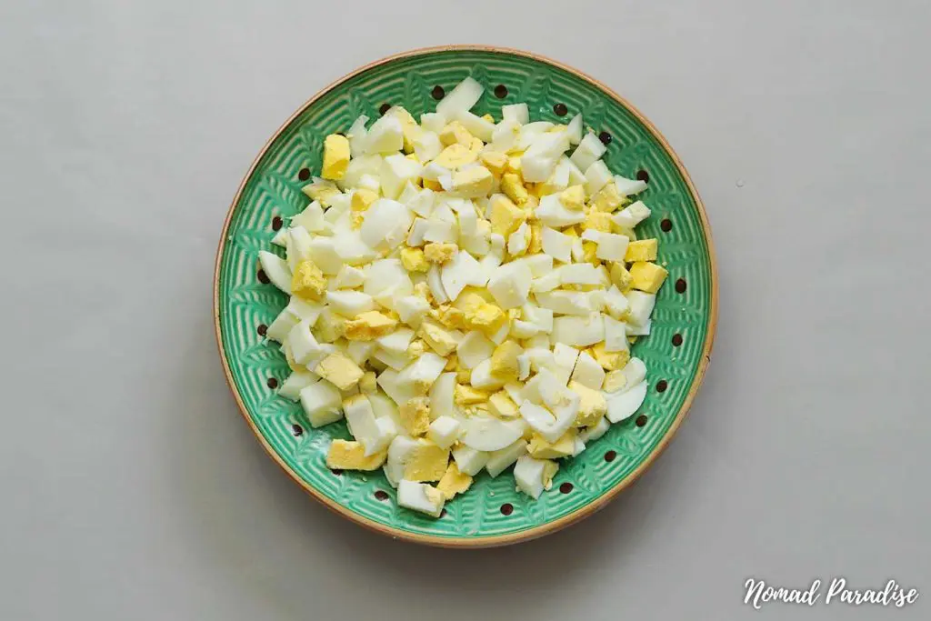 Olivier salad step-by-step (diced eggs).