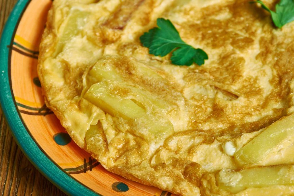 Chipsi Mayai (Chips-Egg Omelette) up-close on a plate