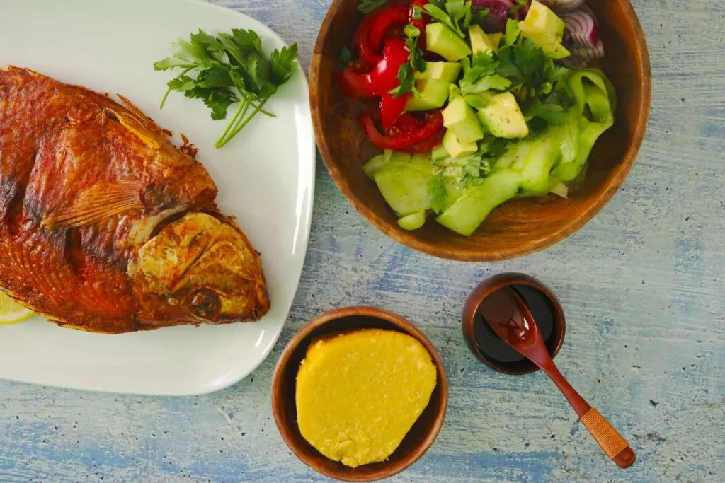 Kachumbari salad served with fish and ugali