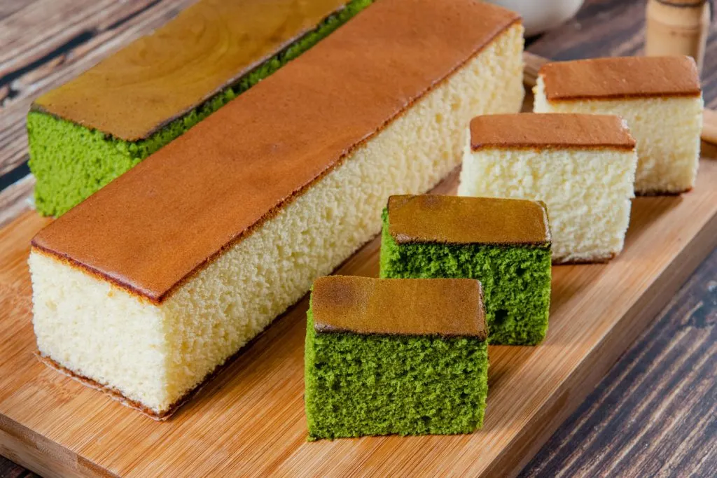Castella (Japanese Honey Sponge Cake) - two long pieces and 4 slices (green and white on the inside).