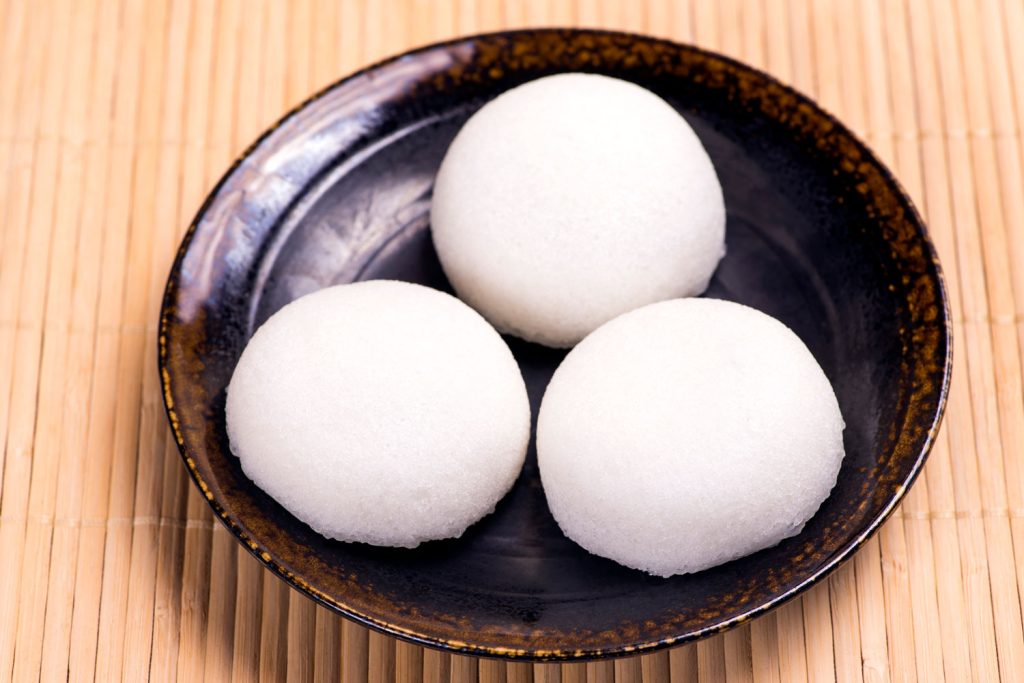 Three Karukan (Steamed Yam Cakes) in a bowl on the table.