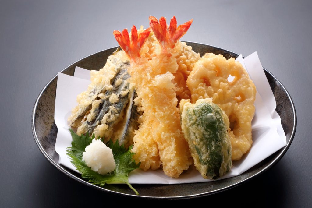 Vegetables, seafood, and meat deep-fried in tempura batter.
