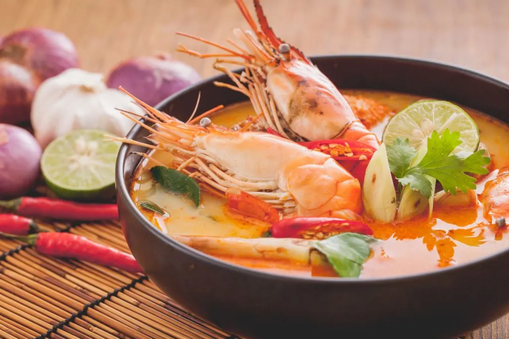 Hot and sour soup with prawns served in a bowl.