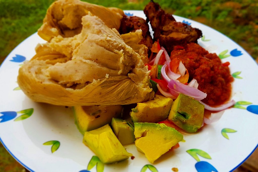 Ga kenkey served with various sides.