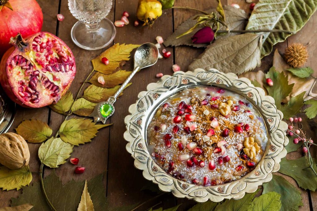 Aşure (Noah’s Ark Pudding) served with pomegranate seeds on top.