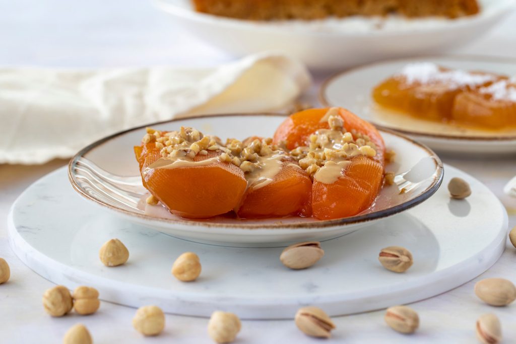 Kabak Tatlısı (Pumpkin Dessert) topped with tahini and nuts.