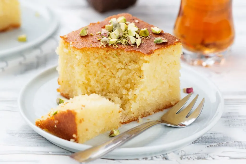 An individual serving of Revani (Semolina Cake in Syrup).