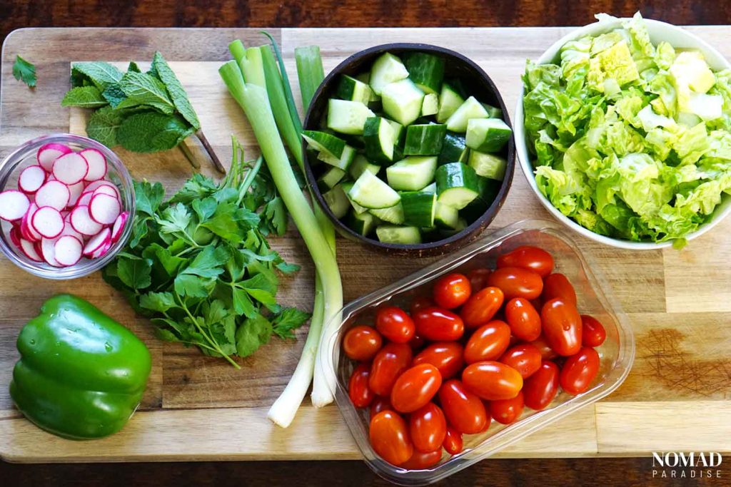 Fattoush Salad ingredients on a board.