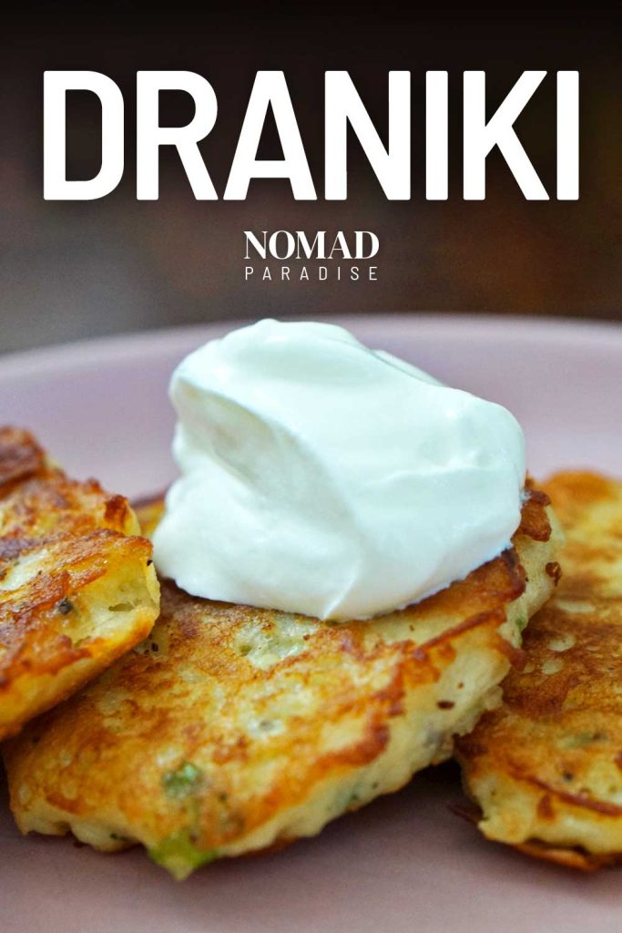 Draniki potato pancakes topped with sour cream.