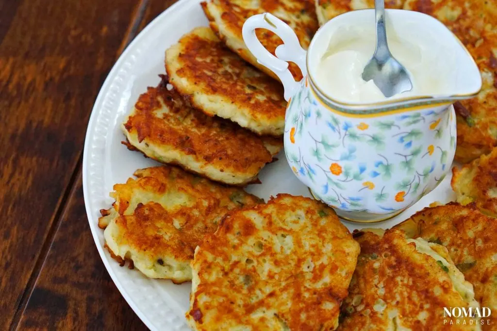 Potato pancakes with sour cream.