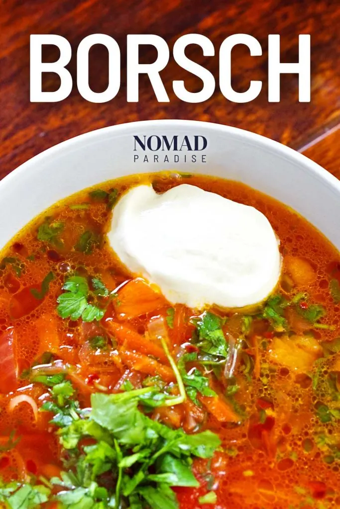 Borsch with a dollop of sour cream and parsley.