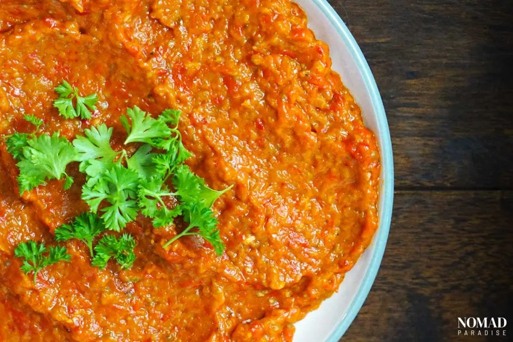 Ajvar topped with parsley.