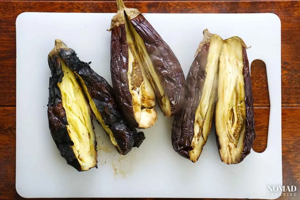 Cooked eggplants cut in half.