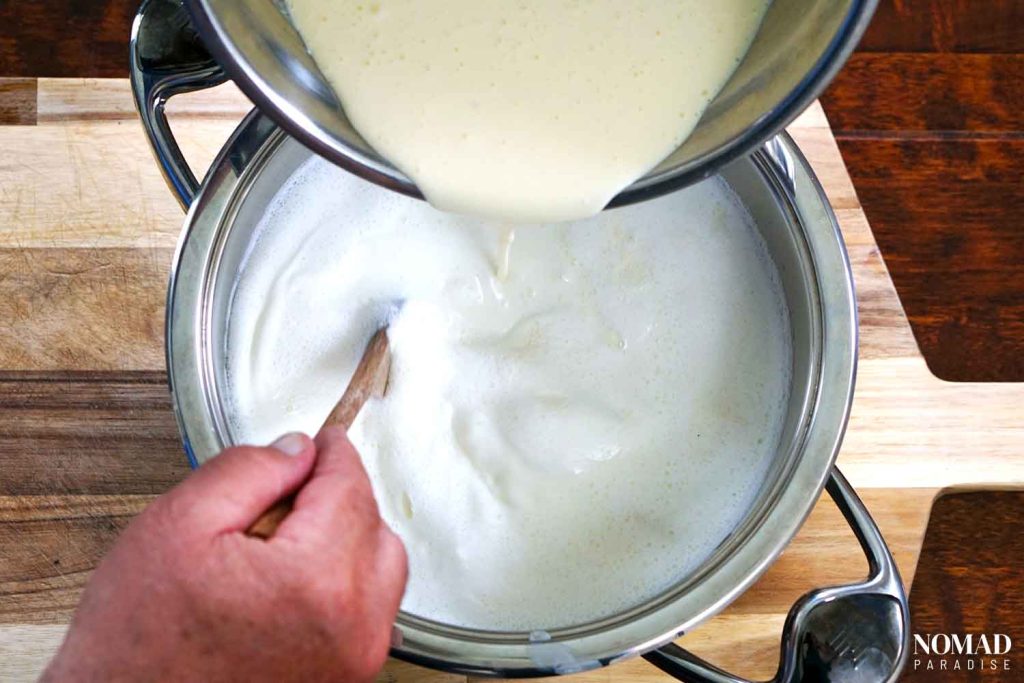 Homemade Farmer's Cheese Recipe step-by-step (adding the mixture to the milk).