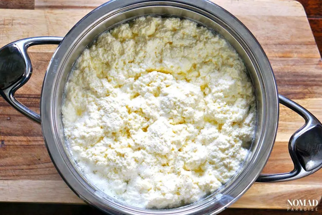 Homemade Farmer's Cheese Recipe step-by-step (cheese curds in the pot).