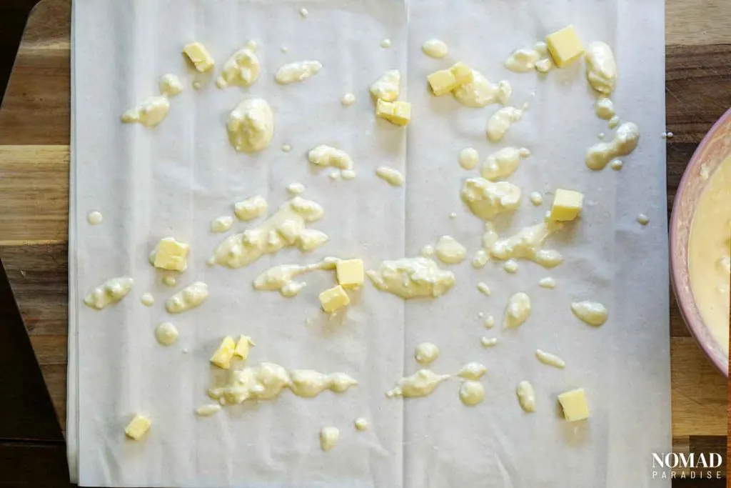 Banitsa Recipe Step by Step (assembling the filo sheets with the cheese mixture and butter).