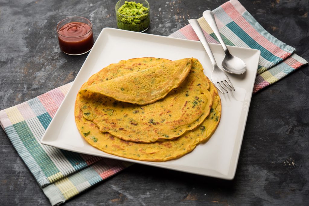 Cheela served with side dips.