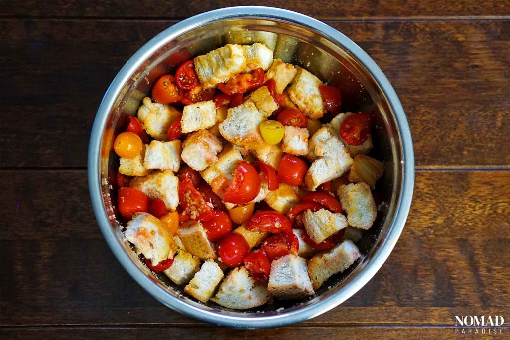 Tomatoes and bread in a bowl.