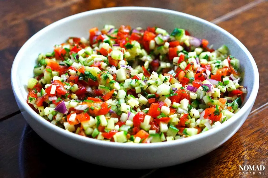 Shirazi Salad finely diced in a white salad bowl