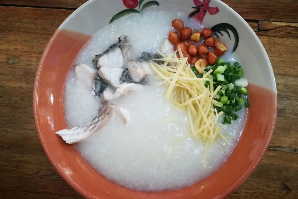 Congee with peanuts, fish, and scallions