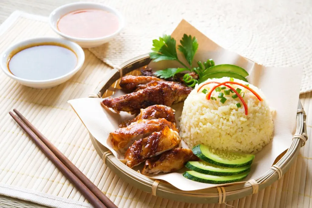 Chicken with Rice and dipping sauces on the side