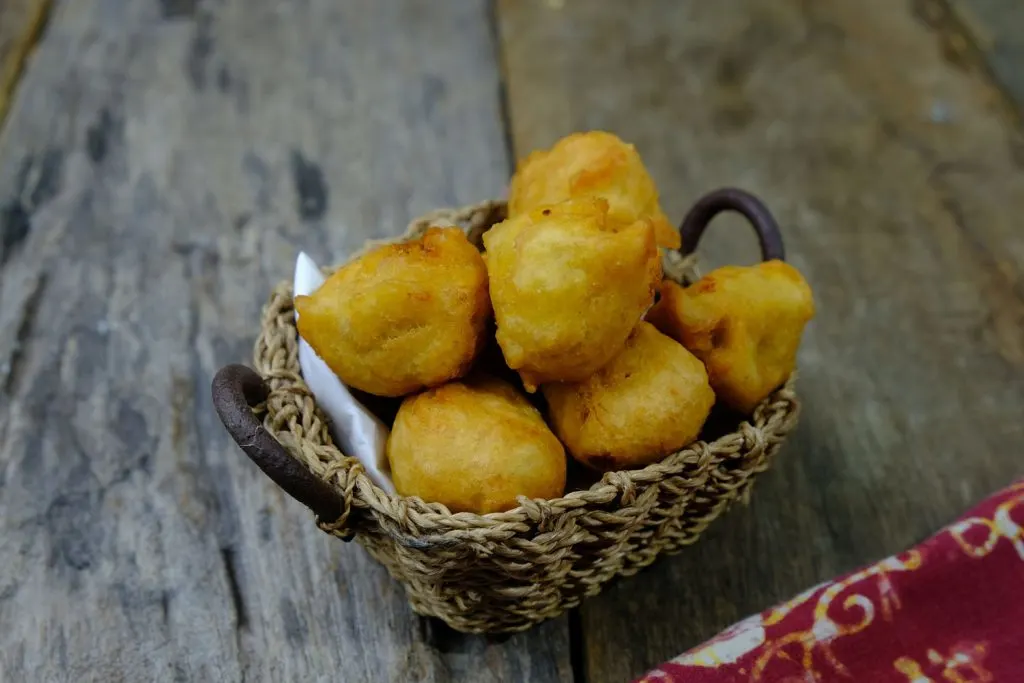 Cekodok fritters in a small serving container.