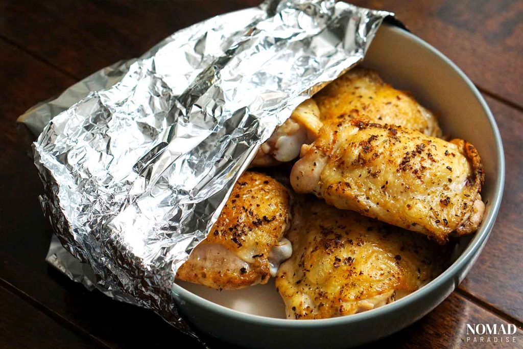Chicken vesuvio step-by-step (chicken thighs set aside in a bowl)