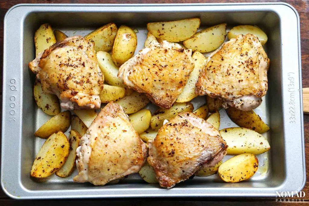 Chicken vesuvio step-by-step (adding the chicken thighs to the potatoes)
