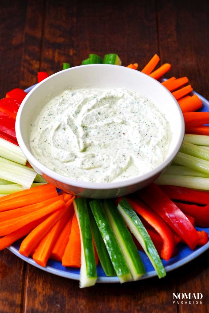 Benedictine spread in a bowl with fresh veggies.