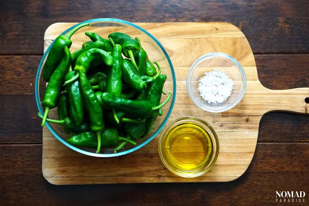 Spanish Padron Peppers ingredients on a wooden board