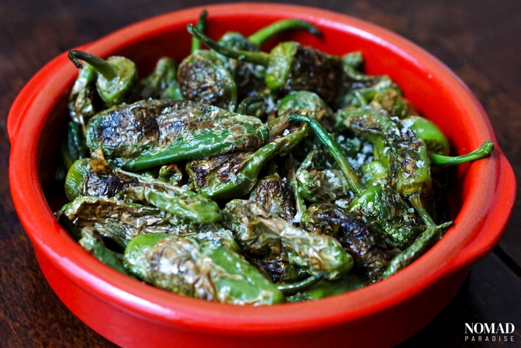 Spanish Padron Peppers in a terra cotta tapas bowl