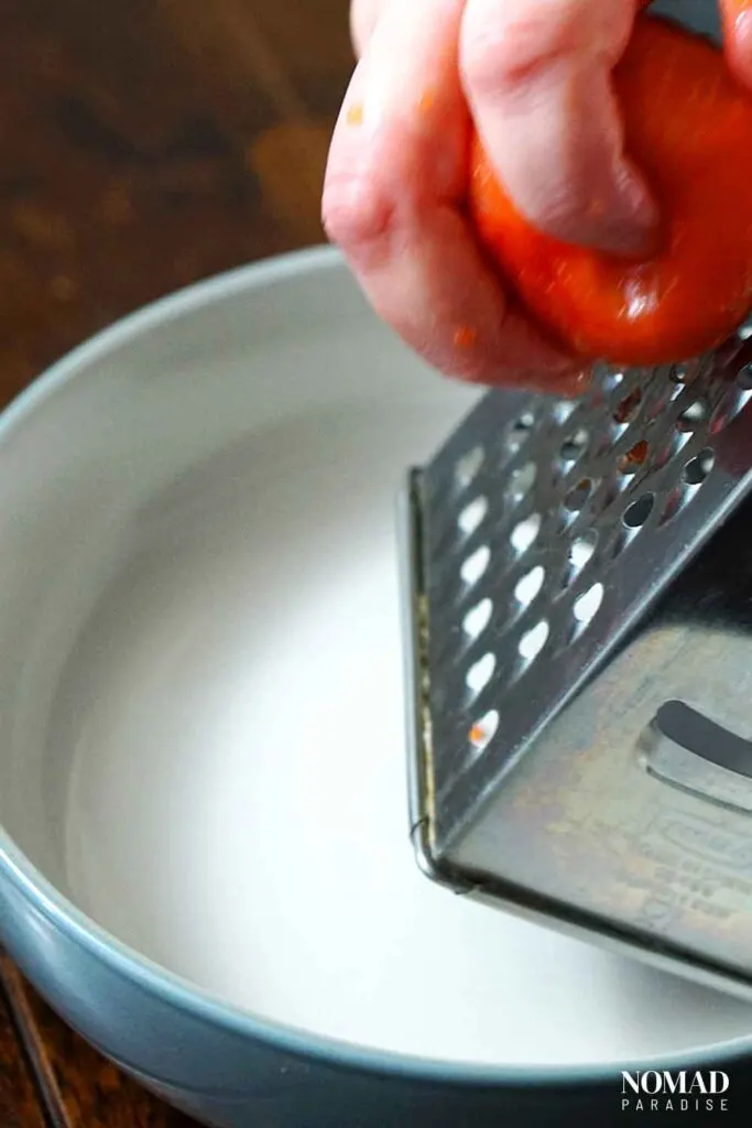 Grating the tomatoes