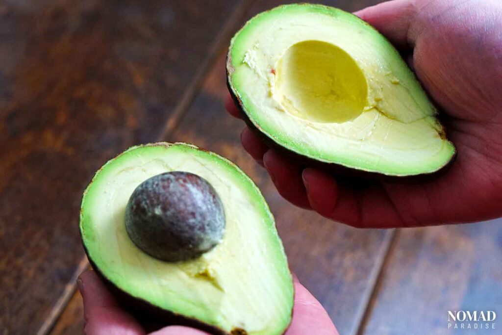 Stuffed avocado step-by-step (cutting the avocado in half).