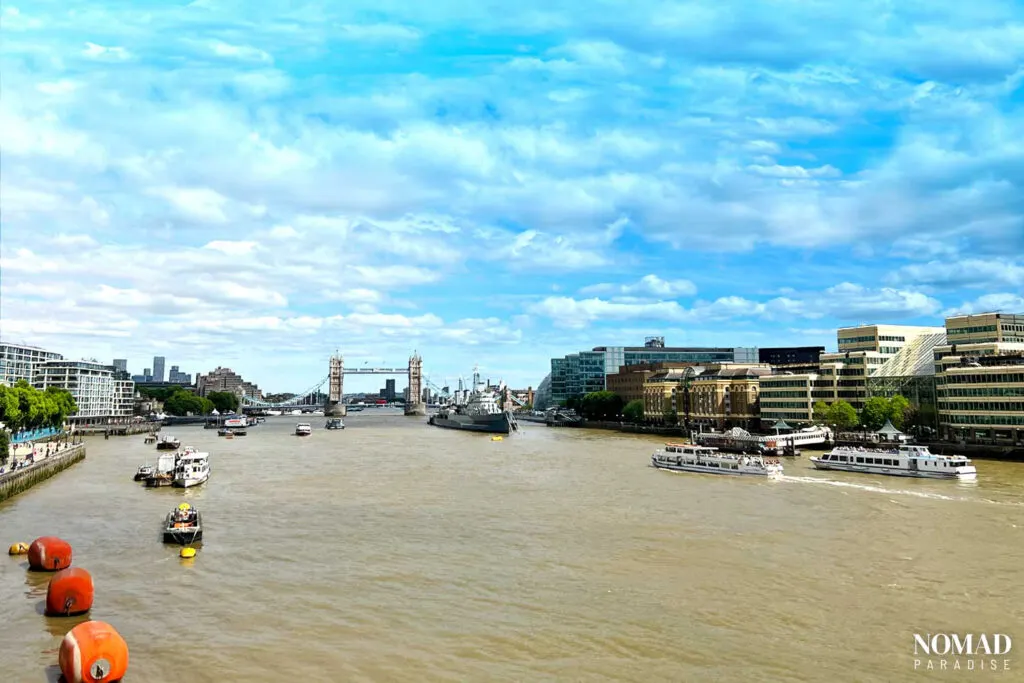 View of Tower Bridge on the River Thames with boats sailing by in London