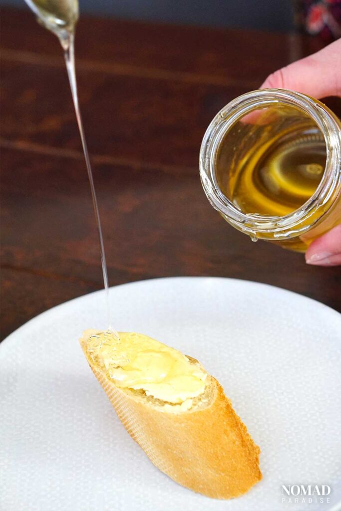 drizzling honey on a tartine.