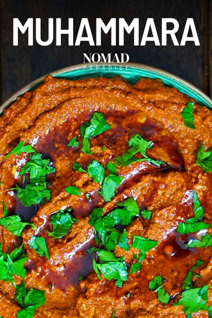 close up top down photograph of muhammara on plate