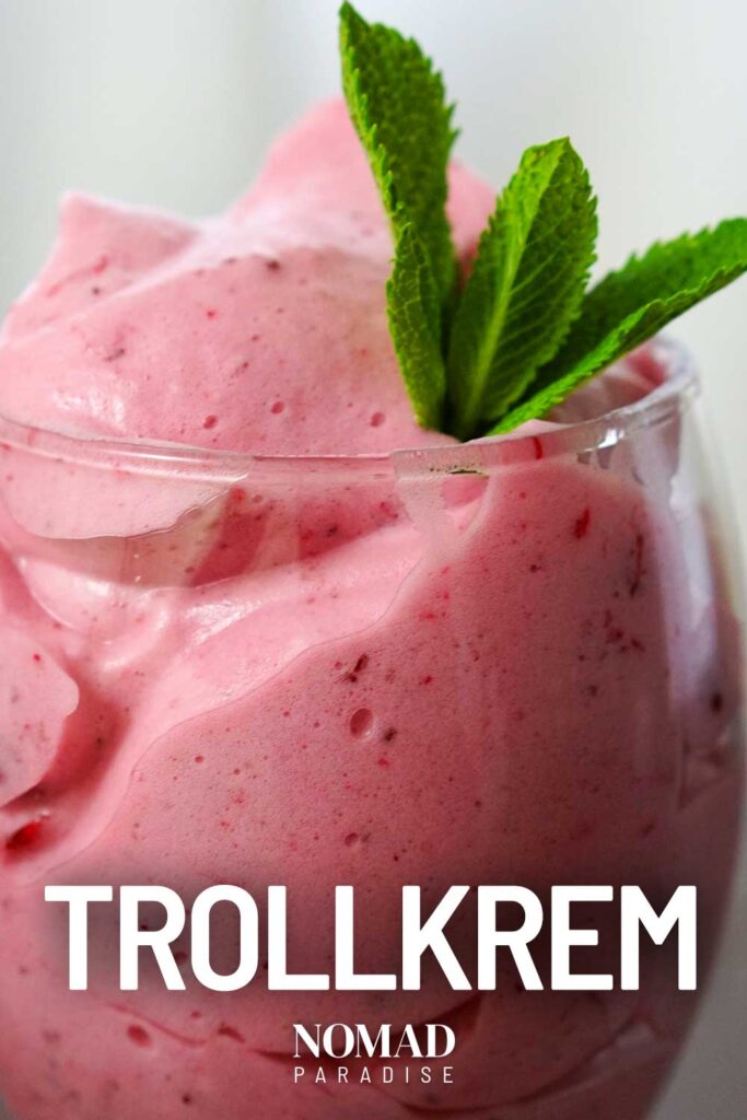 close up photograph of trollkrem dessert in a glass served with mint