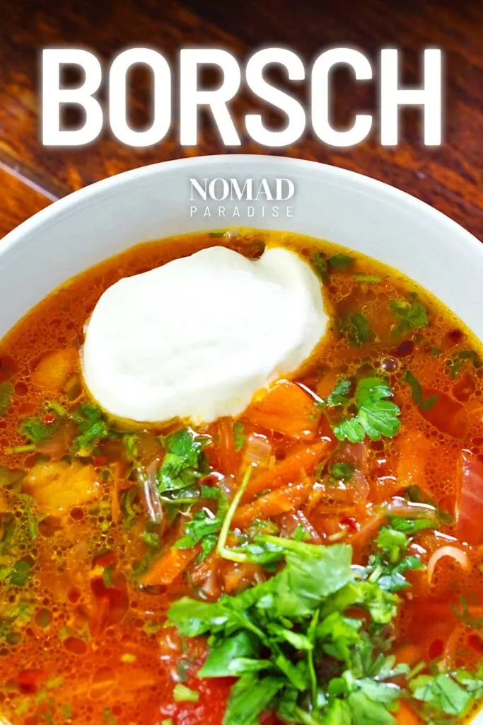 top down view of bowl of borsch with sour cream