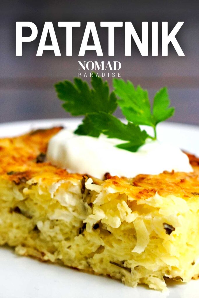 side view of a slice of patatnik with a dollop of sour cream and parsley