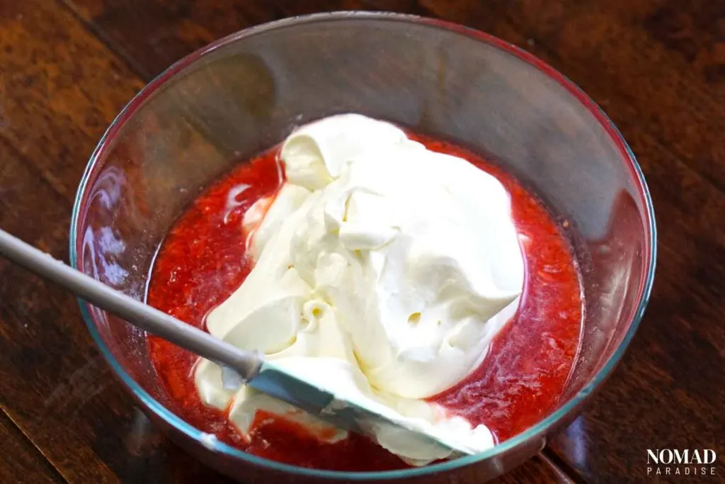 Mixing the strawberries with the whipped cream