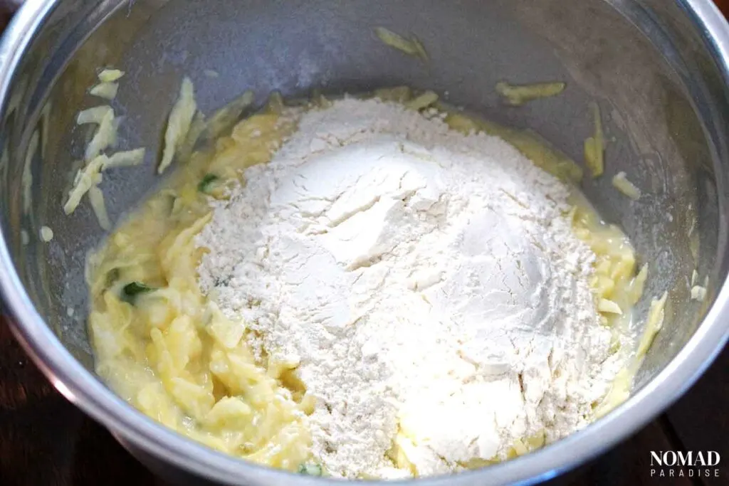 Mixing in flour and potatoes